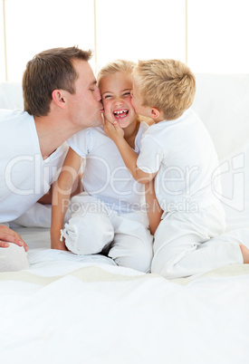 ffectionate father playing with hes children