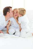 ffectionate father playing with hes children