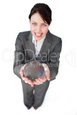 Smiling businesswoman holding a crystal ball