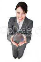 Smiling businesswoman holding a crystal ball
