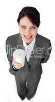 Attractive businesswoman holding a drinking cup