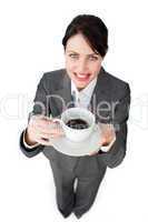 Confident businesswoman drinking a cup of coffee