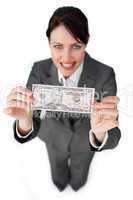 Assertive businesswoman showing a bank note