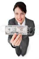 Charming businesswoman showing a bank note