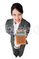 Cheerful businesswoman holding a calculator