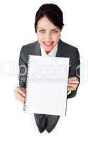 Sparkling businesswoman holding a notebook