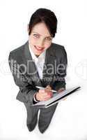 Attractive businesswoman taking notes