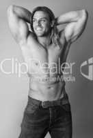 athletic sexy male body builder with the blonde long hair. gladi