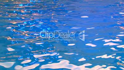 HD Illuminated sparkling blue water surface, closeup