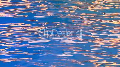 HD Illuminated sparkling blue water surface, closeup