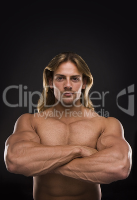 Sexy muscular man isolated on black