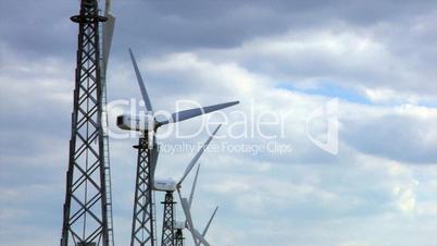 HD group of spinning wind turbines, closeup