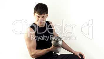 Bodybuilder exercising with weight