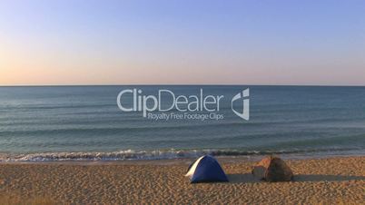 HD Two tents on a sandy beach with sea and skyline background