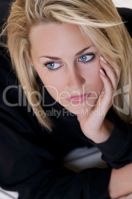 Beautiful But Sad Young Blond Woman With Blue Eyes