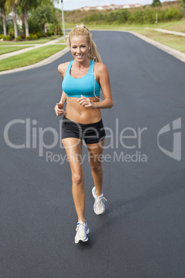 Beautiful Blond Woman Running and Listening to MP3 Player