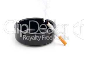 cigarette in a black ashtray