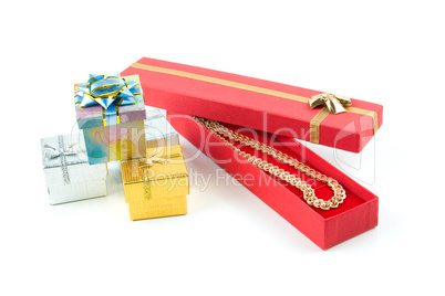 gold necklace in red box