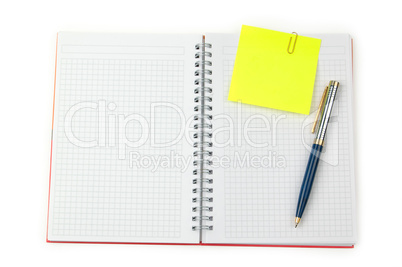 note and pen on a notebook