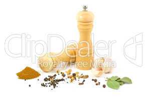 wooden salt shaker and pepper grinder and set of spices