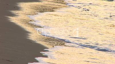 HD Gentle waves on a sandy beach