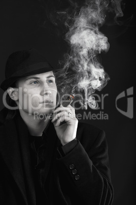 Man in black hat smoke cigar