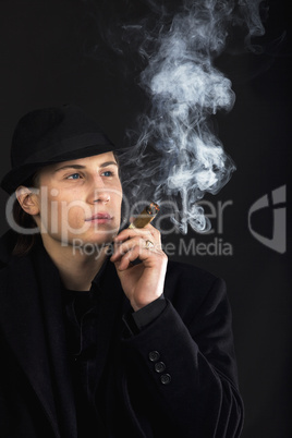 Man in black hat smoke cigar