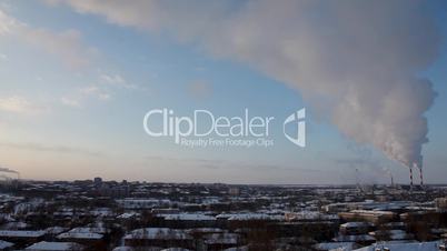 Pipe with smoke in winter sunrise time lapse