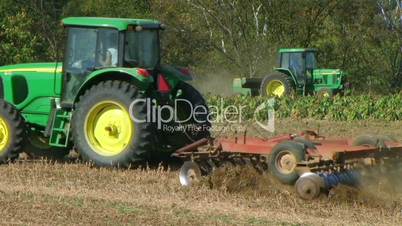 Tractors Discing And Sowing Field