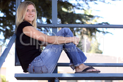 Pretty Woman Sitting in Bleachers