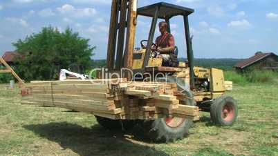 Forklift Unloading Construction Lumber