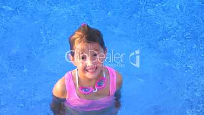 Girl Swimming and Smiling