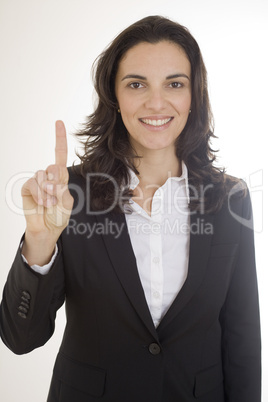 Hübsche Frau zeigt mit ihrem Finger die Zahl eins an