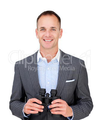 Happy businessman holding binoculars