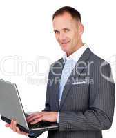 Charismatic businessman using a laptop