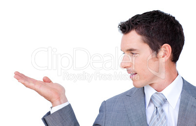 Positive businessman looking at his hand