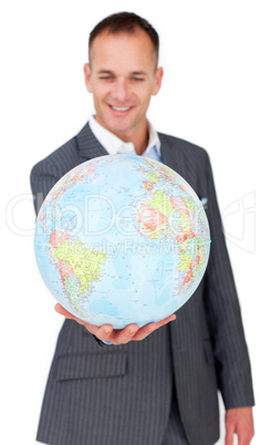 Self-assured businessman smiling at global business expansion