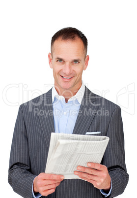 Mature businessman reading a newspaper