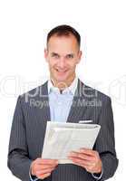 Mature businessman reading a newspaper