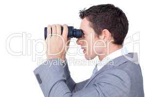 businessman looking through binoculars