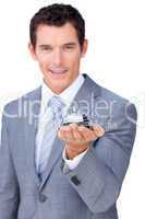 Smiling businessman holding a service bell