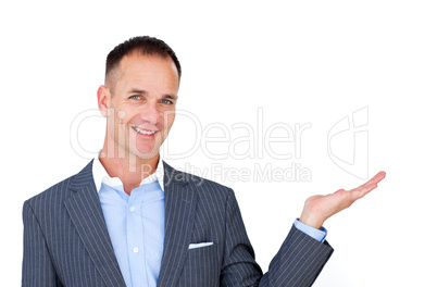 Smiling businessman showing a copyspace