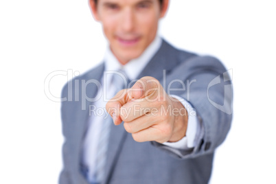 Close-up of a businessman pointing at the camera