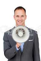 Confident businessman holding a megaphone