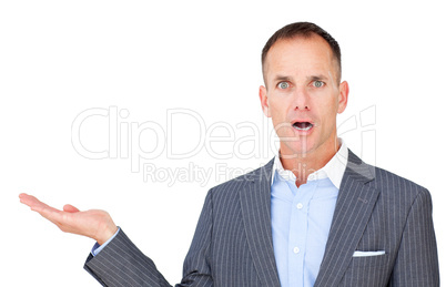 Surprised businessman showing a copyspace