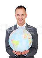 Assertive businessman holding a terreatrial globe