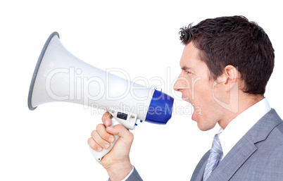 Young businessman yelling through a megaphone