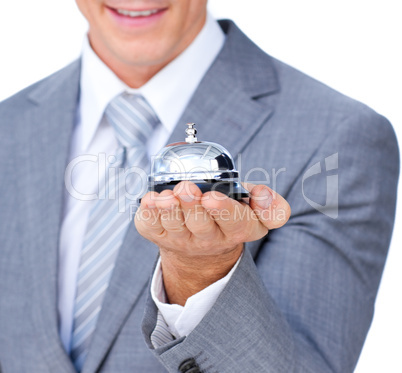 Close-up of a businessman holding a service bell