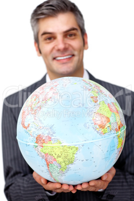 Mature businessman holding a terrestrial globe
