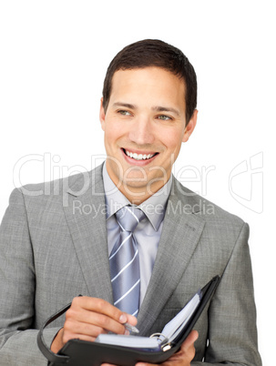 Attractive young businessman holding an agenda